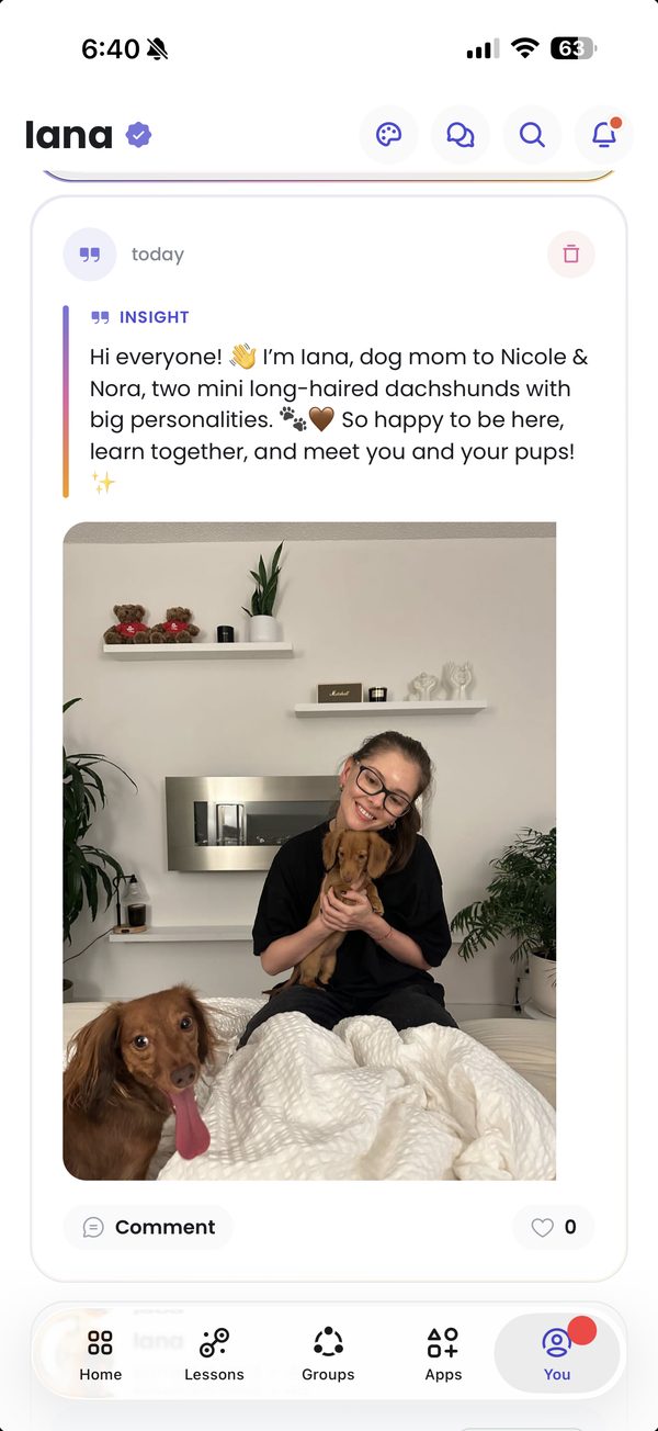 A member introduction post inside the Astra Trainer pet-creator community — a dog mom with her two mini long-haired dachshunds, Nicole and Nora